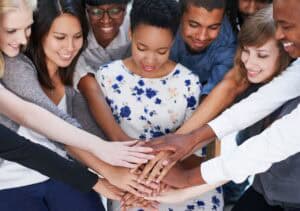 Business people, teamwork and circle together for corporate collaboration, community support and diversity. happy, employees and hands in huddle for connection, partnership and solidarity with trust
